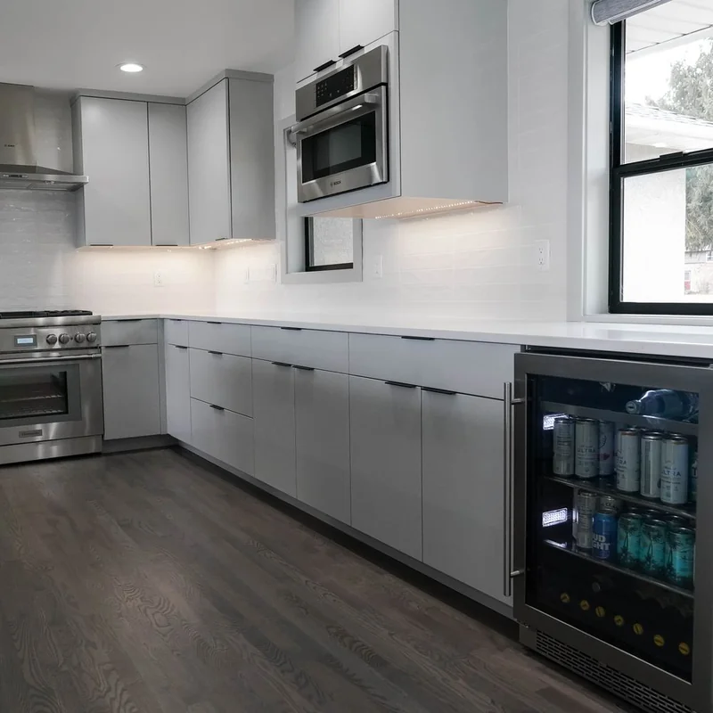 Bosch range and hood on the perimeter run of the grey kitchen