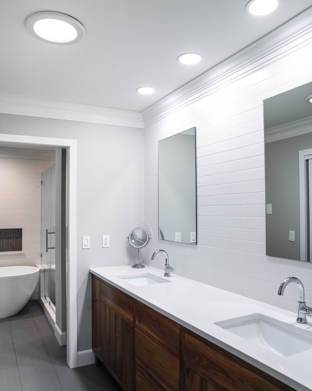 Walnut double vanity with a white quartz top