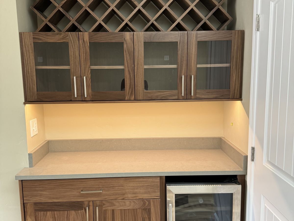 Built-in walnut wine nook with a diamond rack